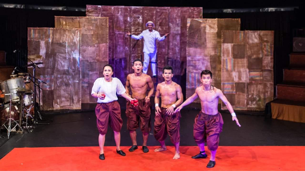 Watch in awe as flames dance through the night at Phare, The Cambodian Circus, where danger and beauty intertwine